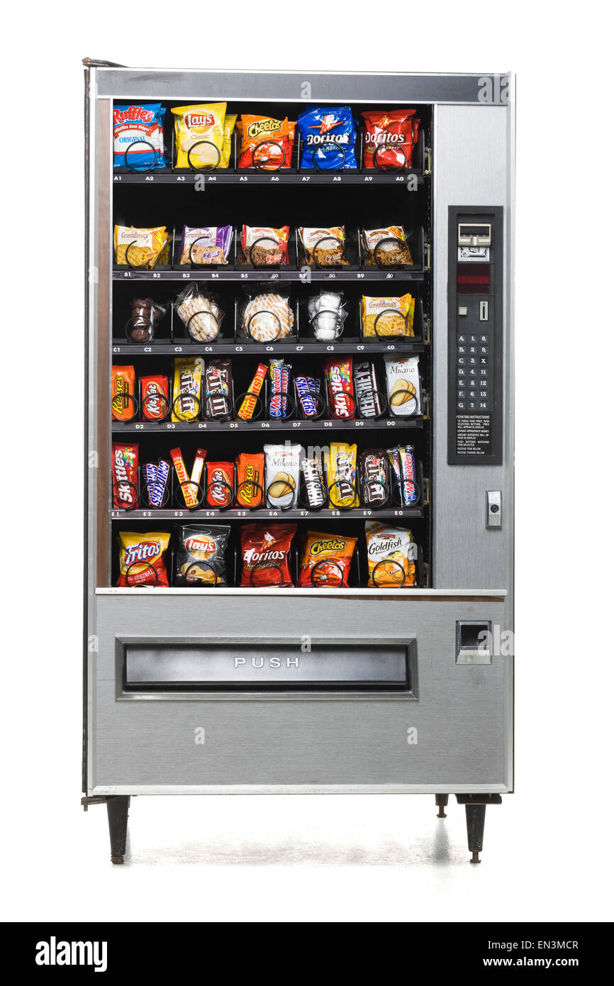 Máquinas expendedoras de comida basura completo Foto de stock