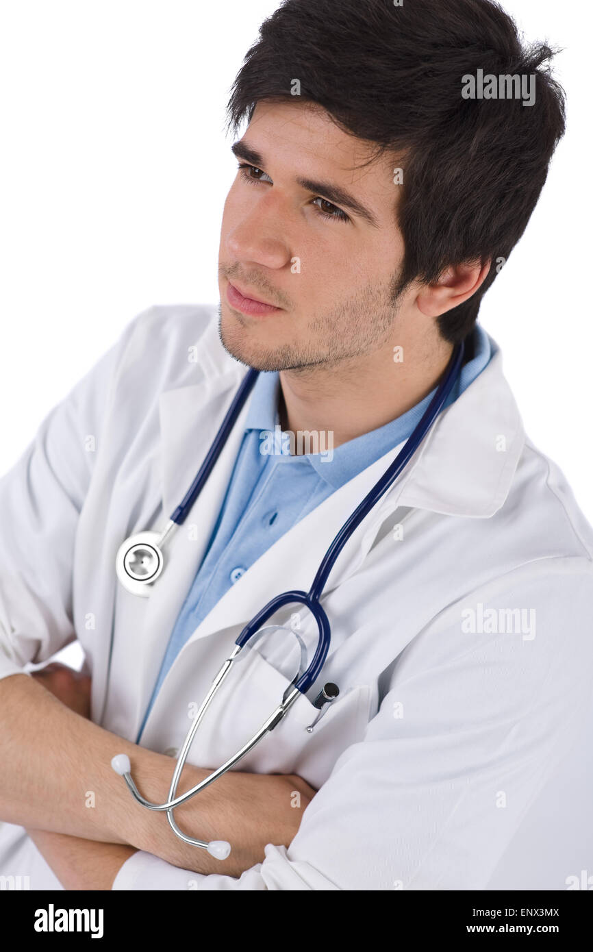 Un estudiante de sexo masculino con un estetoscopio médico de brazos cruzados. Foto de stock