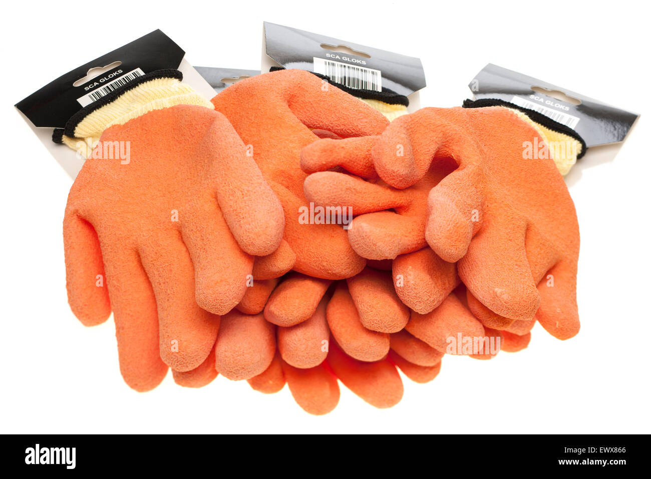 Cuatro pares de naranja y amarillo, recubierta de látex antideslizante y tejidos sin costuras de desgaste de seguridad guantes de trabajo Foto de stock