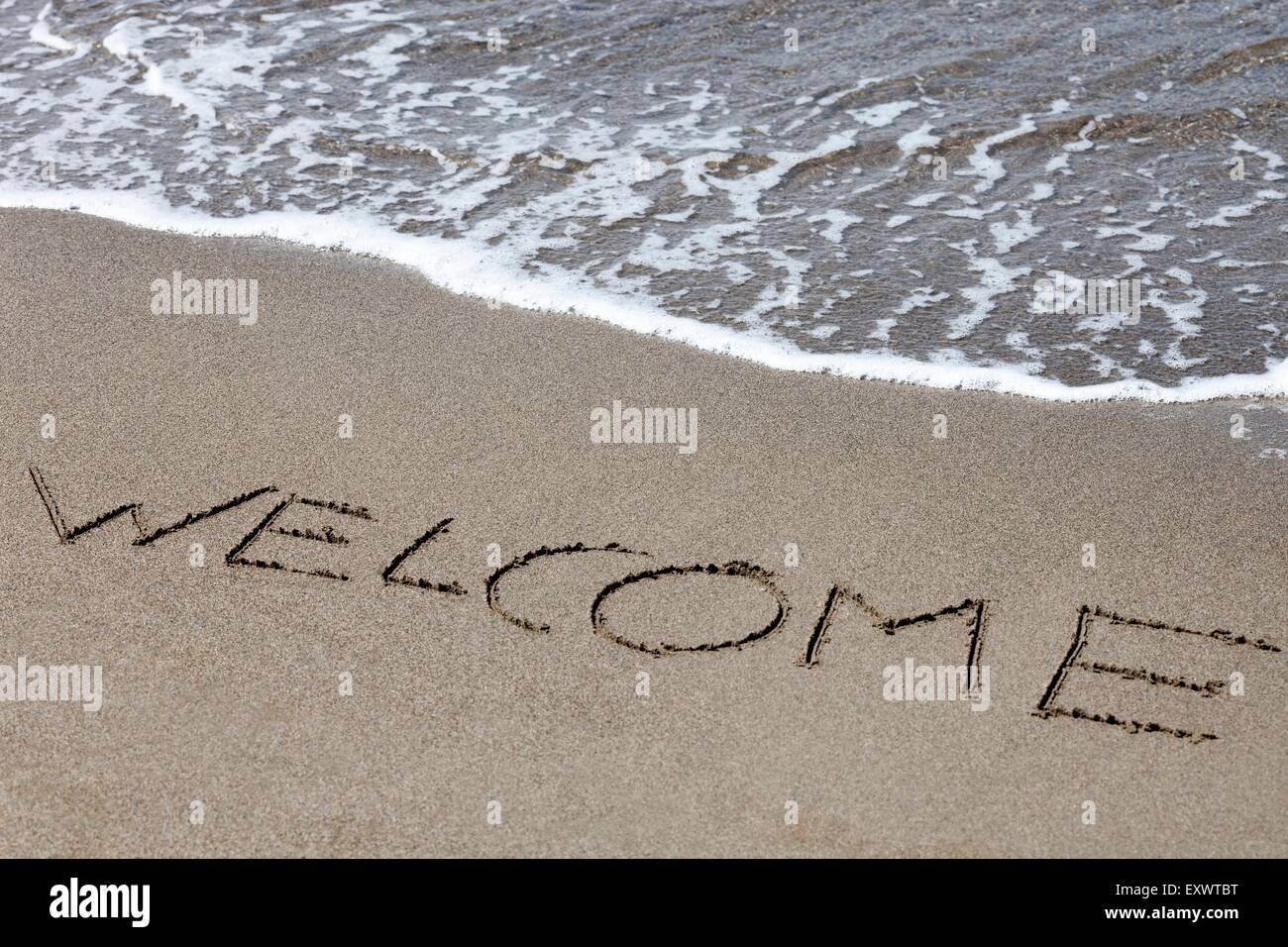 Bienvenido pintado en la arena, Italia, Europa Foto de stock