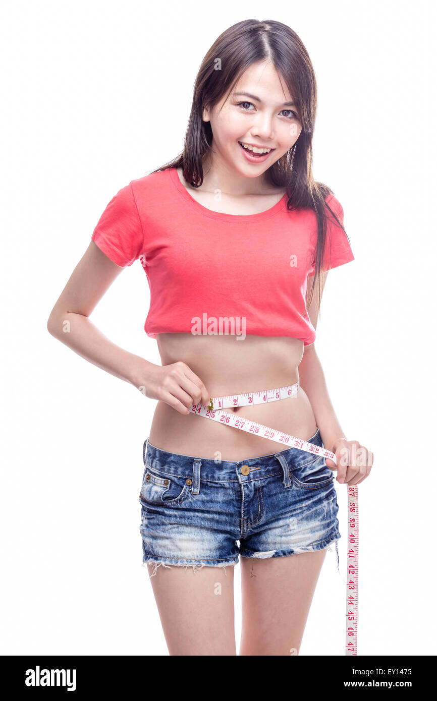 Mujer China la medición de cintura con cinta adhesiva. Foto de stock