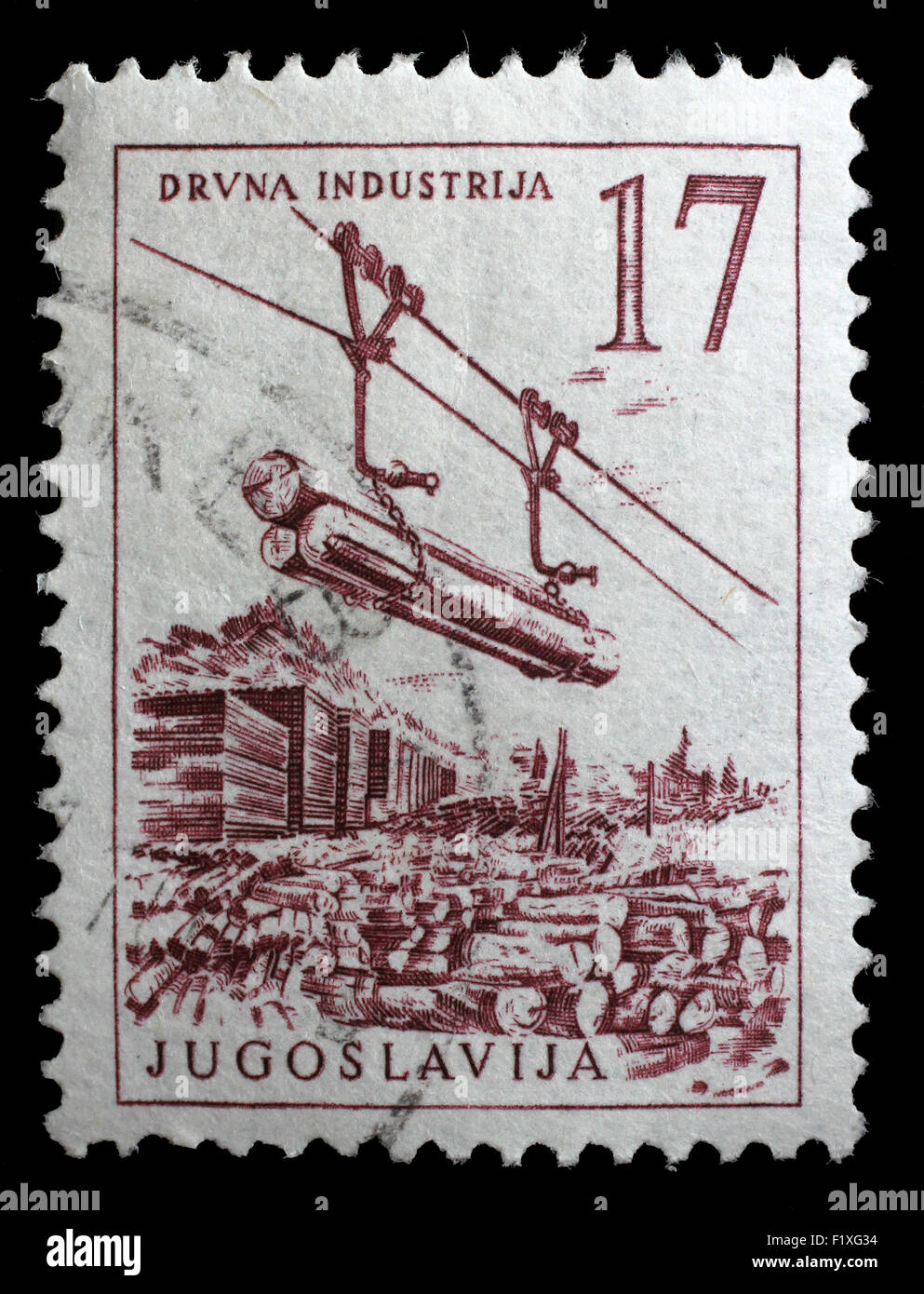 Sello impreso en Yugoslavia muestra industria maderera, circa 1958 Foto de stock