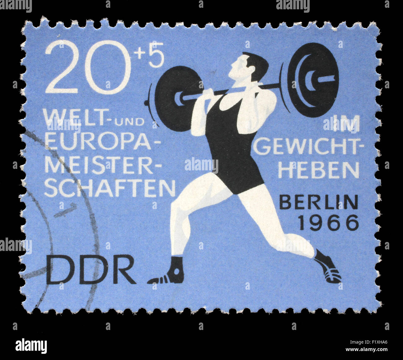 Sello impreso en la RDA (República Democrática Alemana (Alemania Oriental) muestra levantador de pesas, circa 1966 Foto de stock