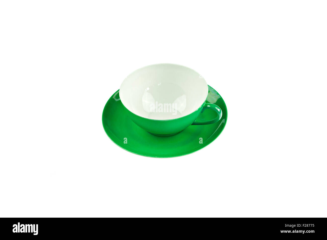 Taza y plato verde, fondo blanco. Foto de stock
