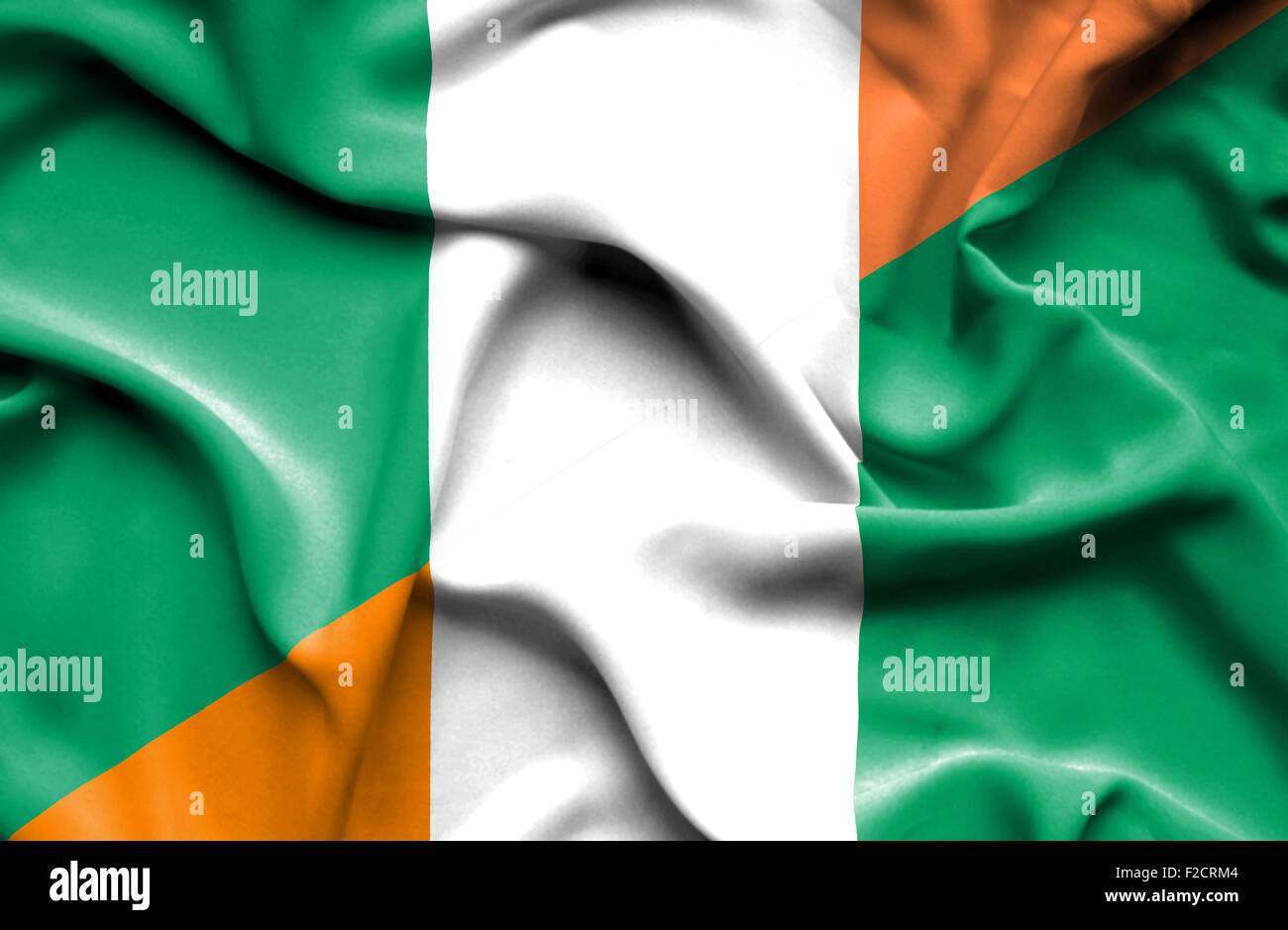 Bandera De Costa De Marfil E Irlanda Ondeando la bandera de Costa de Marfil e Irlanda Fotografía de stock - Alamy