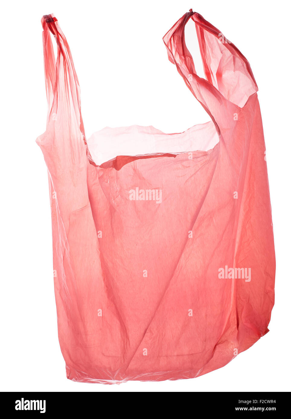 Vacíe la bolsa de plástico rosa, iluminada desde atrás, flotante Foto de stock