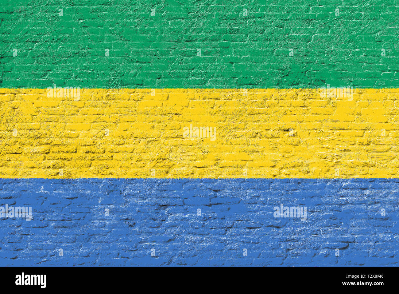Gabón - bandera nacional sobre pared de ladrillo Foto de stock