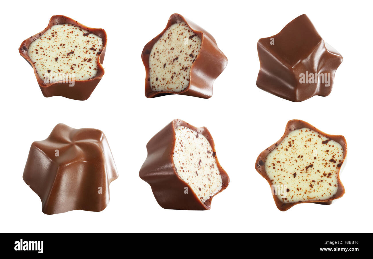 Alimentos Dulces. Conjunto de chocolates sobre fondo blanco. Foto de stock