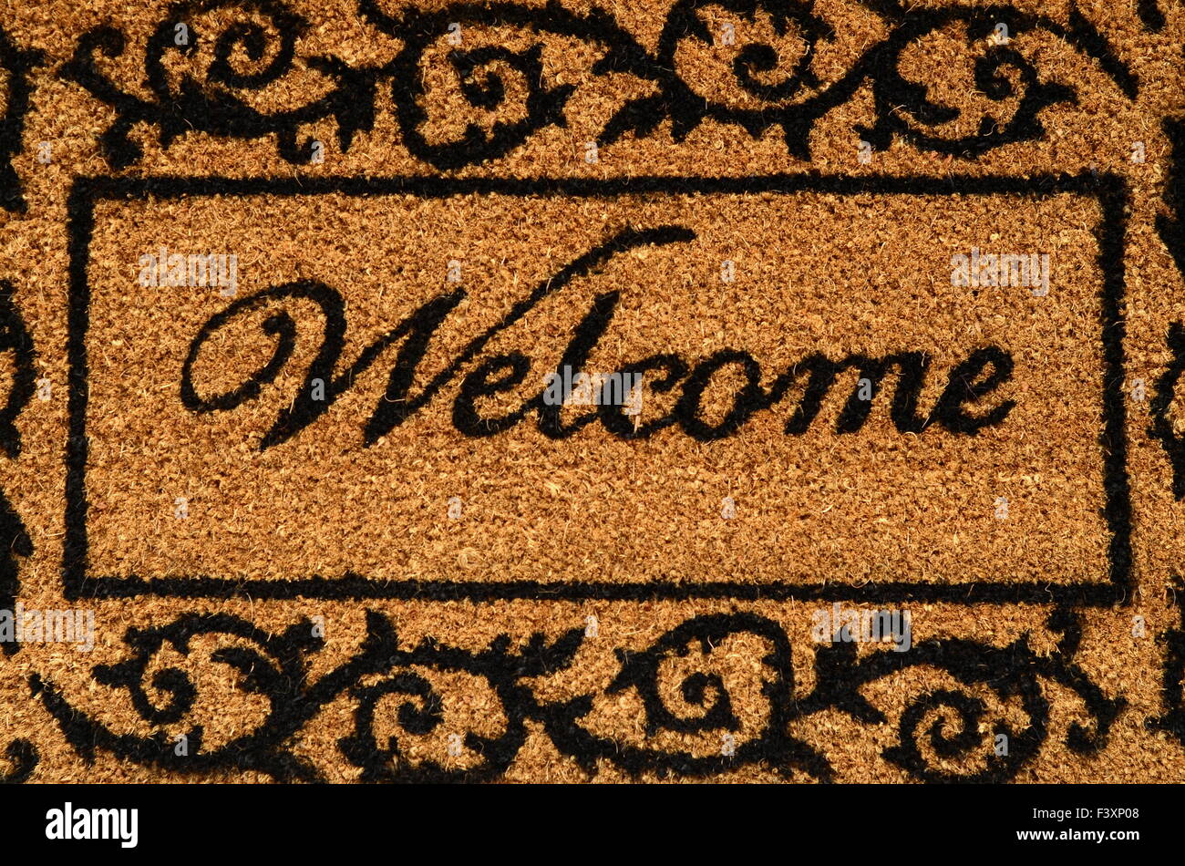 Imagen conceptual de una estera de puerta de bienvenida Foto de stock