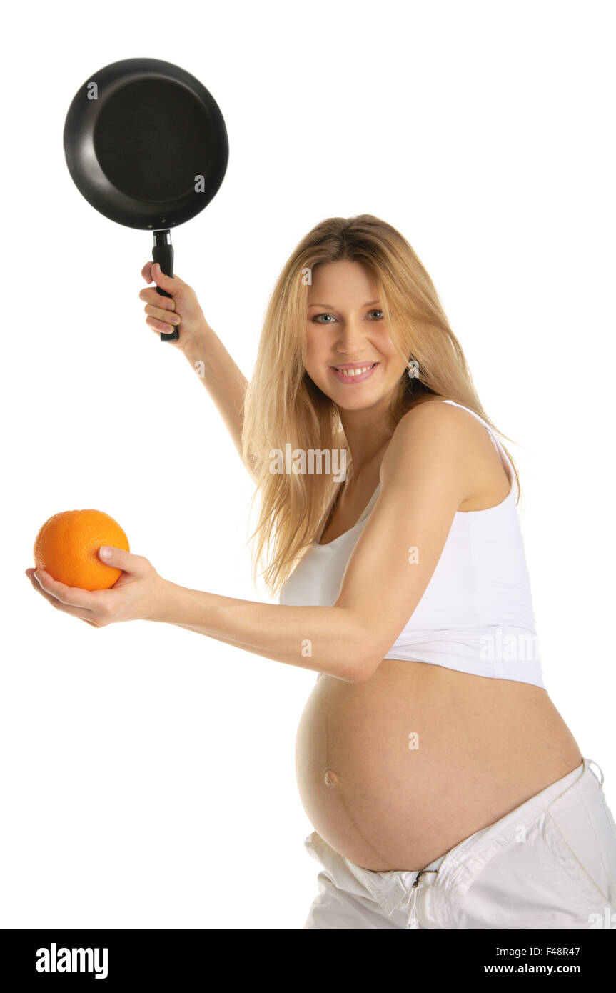 Mujer embarazada jugando a tenis naranja y pan Foto de stock