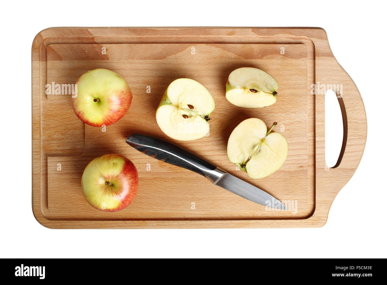 Manzanas en placa de corte Foto de stock