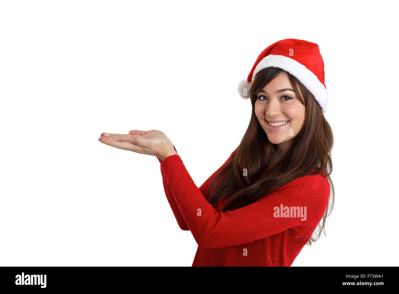 Santa Claus Navidad Mujer sosteniendo producto sobre fondo blanco. Foto de stock