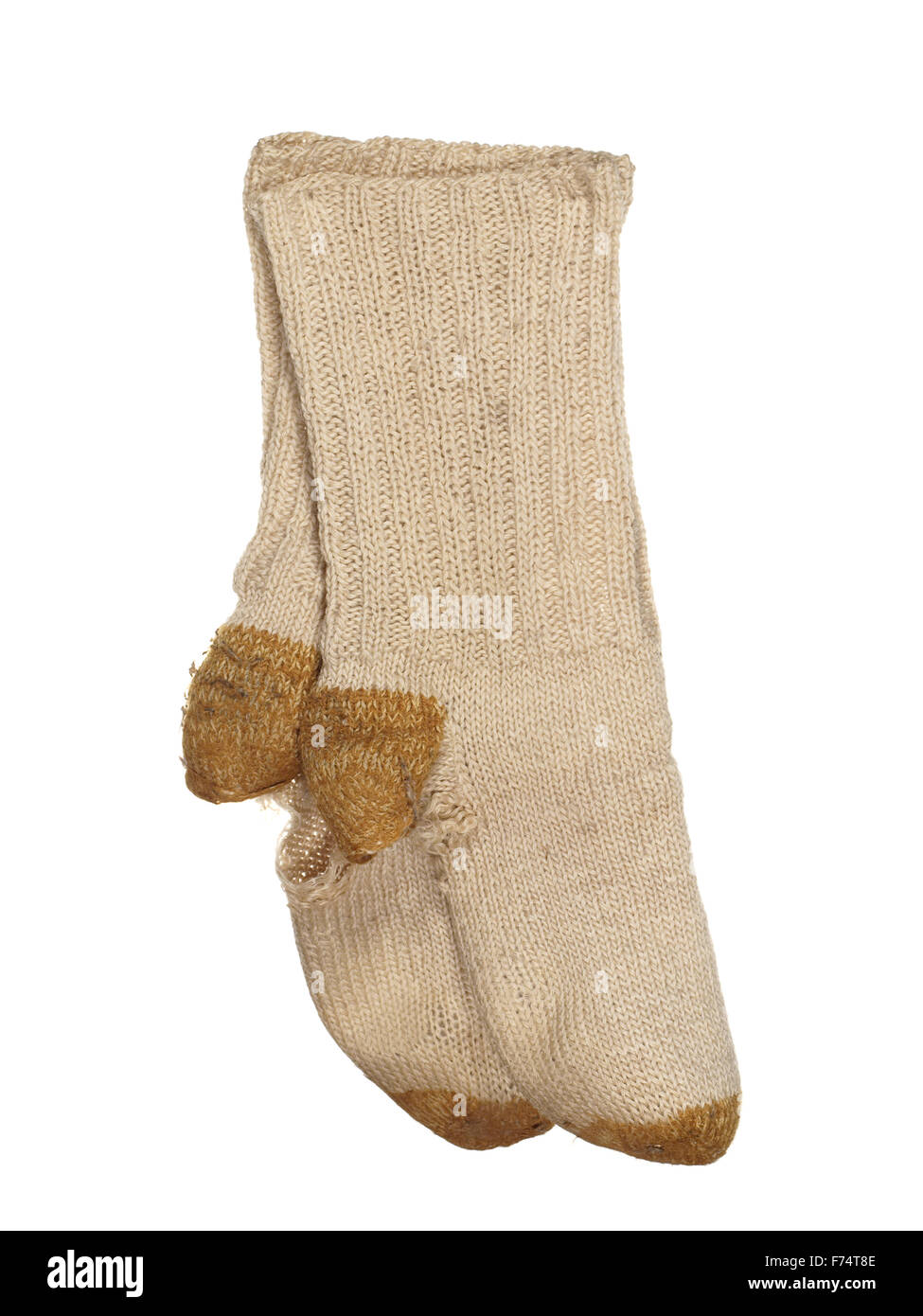 Viejos andrajosos calcetines de lana aislado sobre un fondo blanco. Foto de stock
