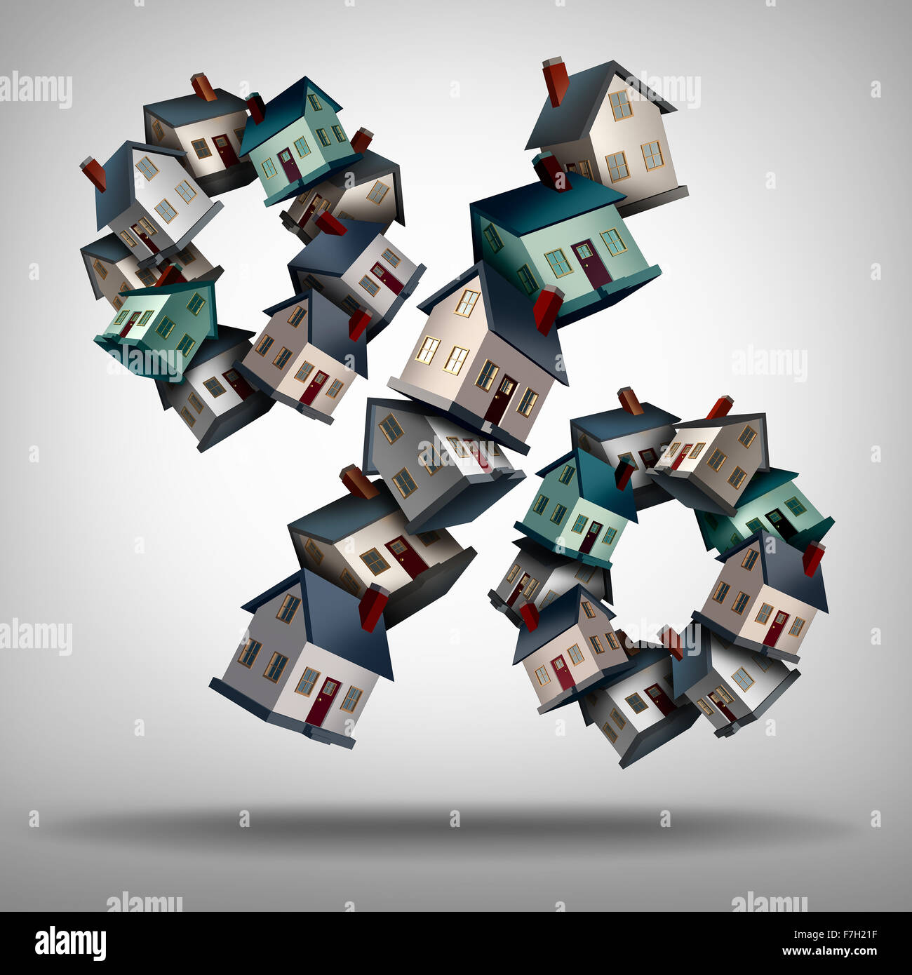 Las tasas de hipotecas de tasa de interés y el concepto de símbolo como un grupo de casas o casas en forma de un signo de porcentaje para un préstamo de la casa Foto de stock