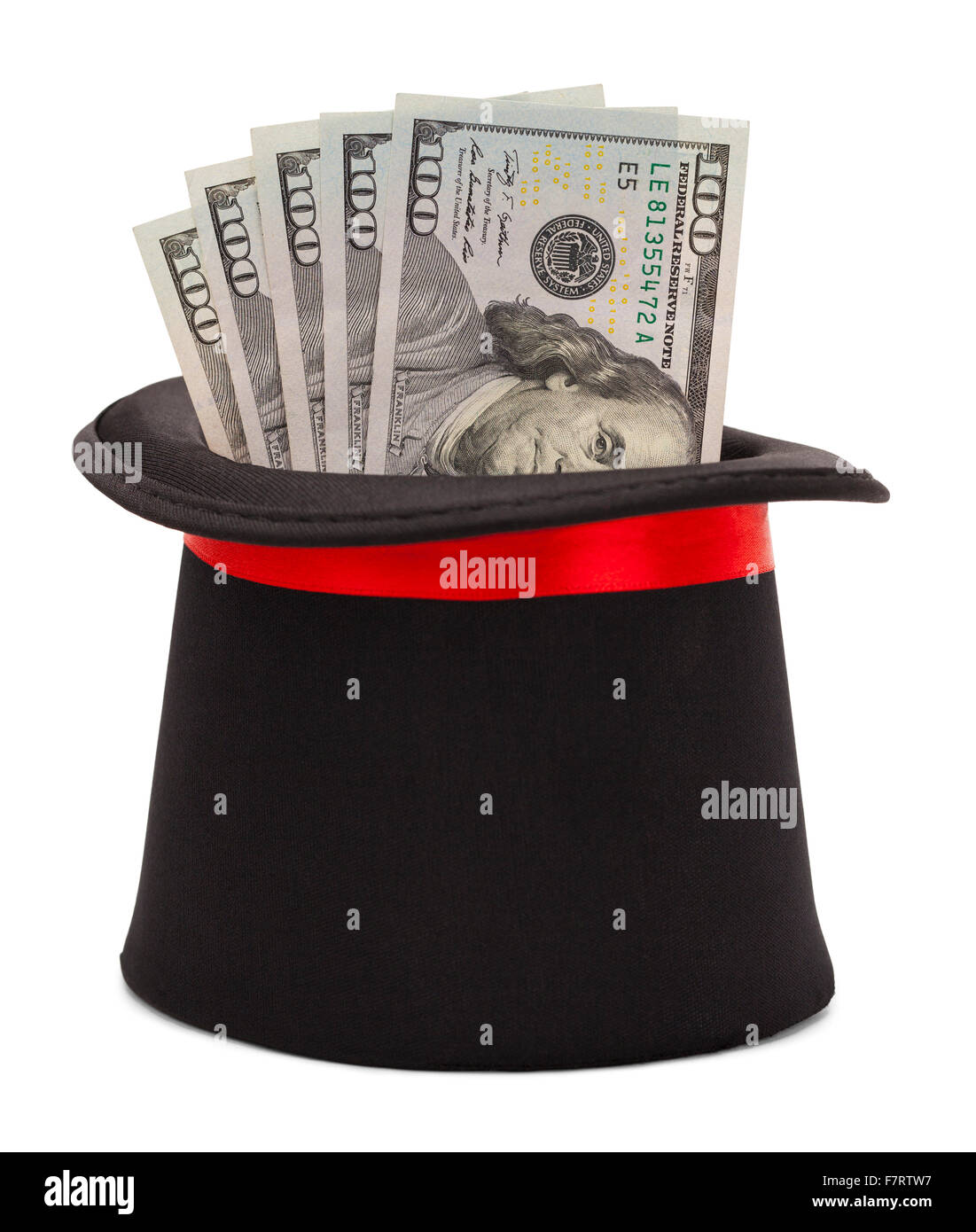Magic Top Hat con dinero en efectivo que sale aislado sobre fondo blanco. Foto de stock