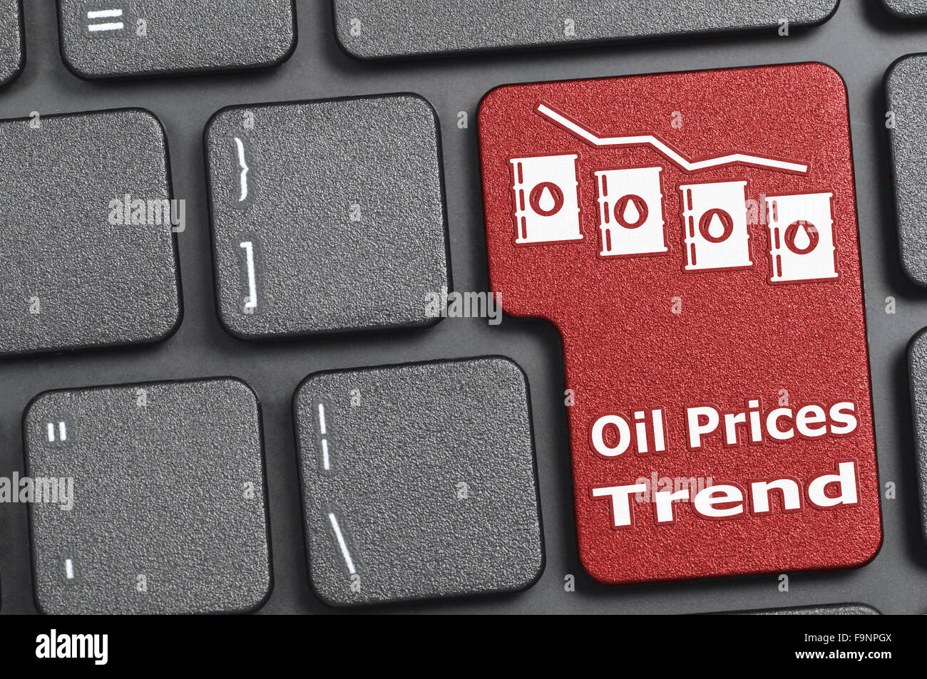 La tendencia de los precios del petróleo rojo tecla del teclado Foto de stock