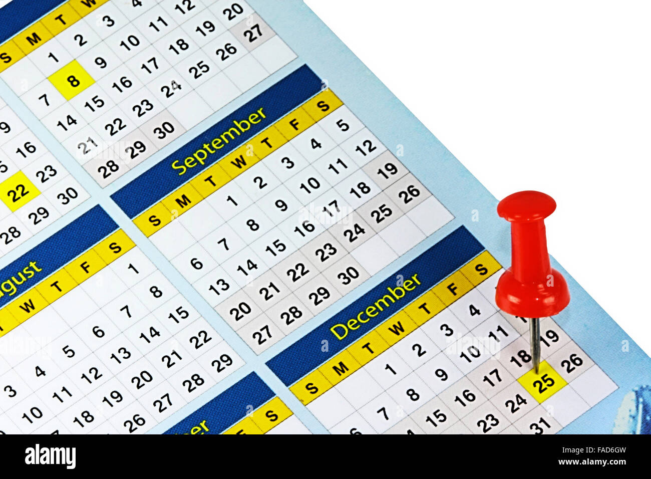 Un calendario con una chincheta roja por fecha Foto de stock
