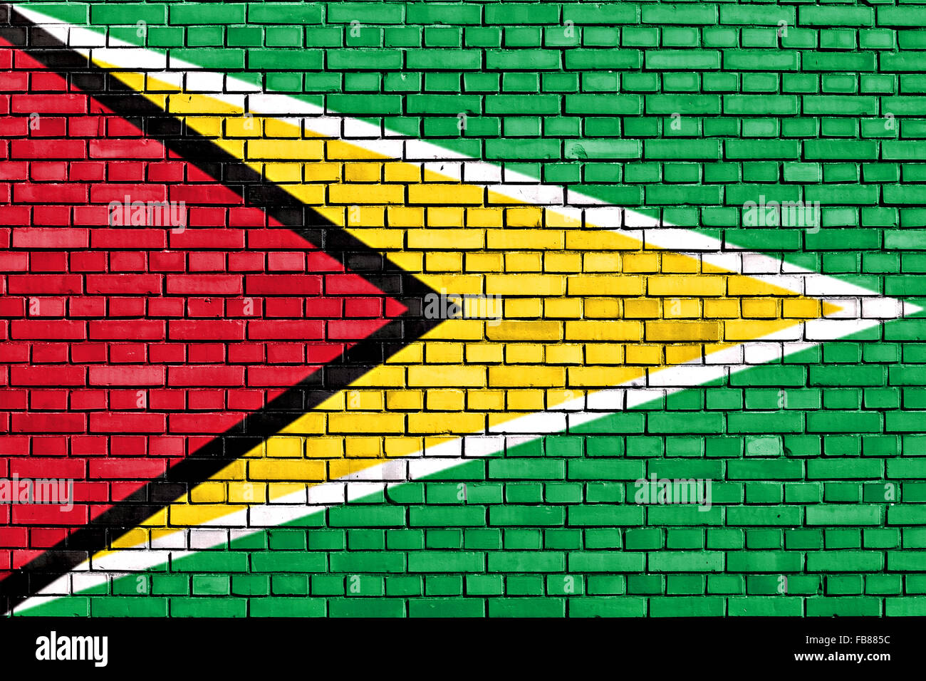 La bandera de Guyana pintado sobre la pared de ladrillo Foto de stock