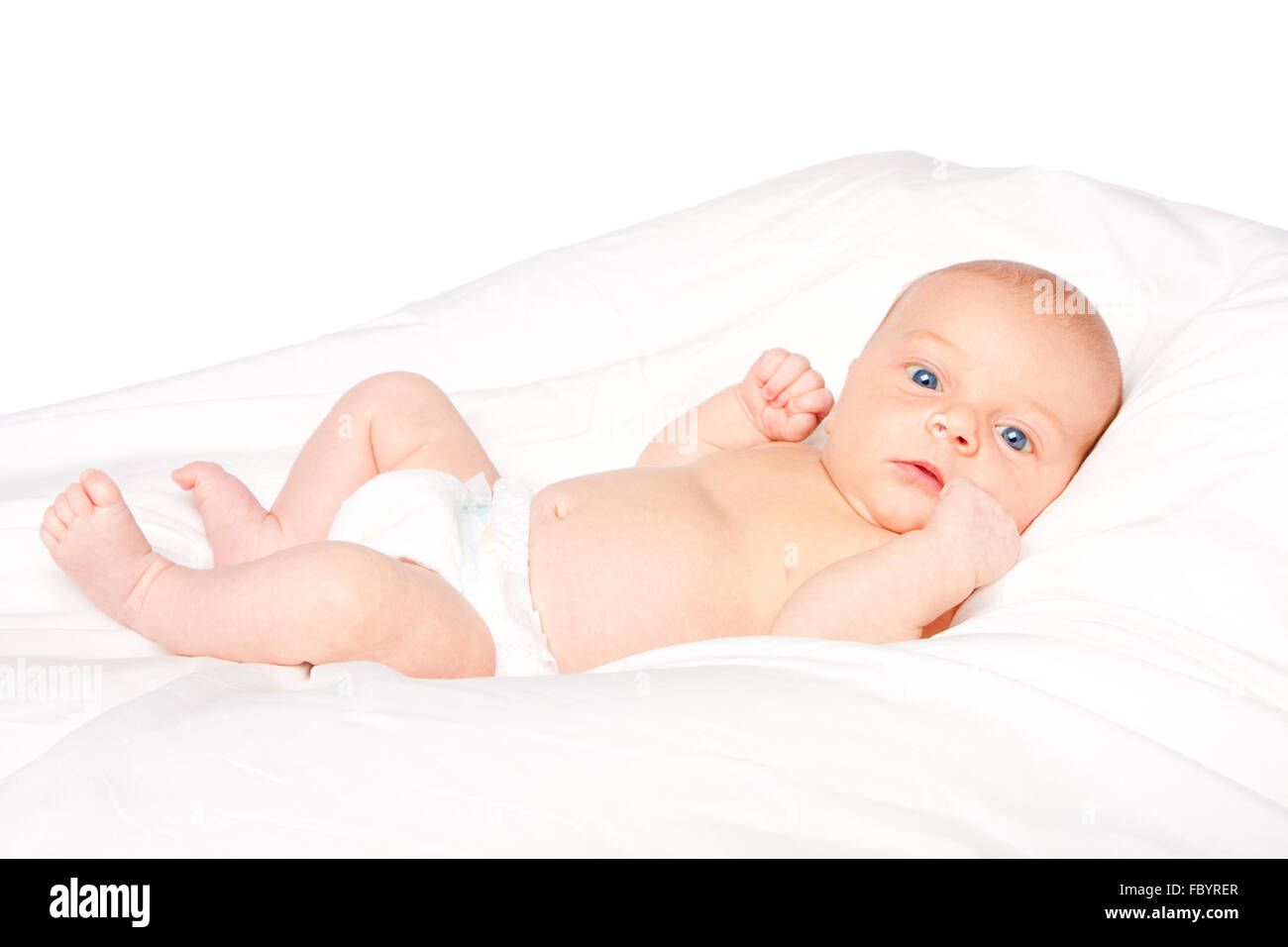 Lindo bebé lactante recostada sobre la almohada Foto de stock