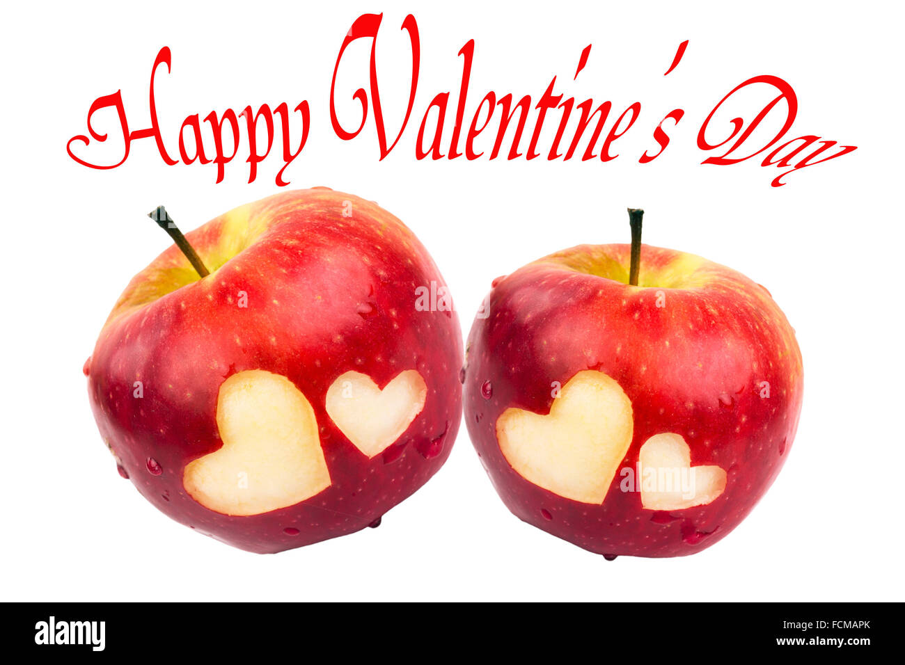 Feliz Día de San Valentín, dos manzanas con corazones sobre un fondo blanco. Foto de stock