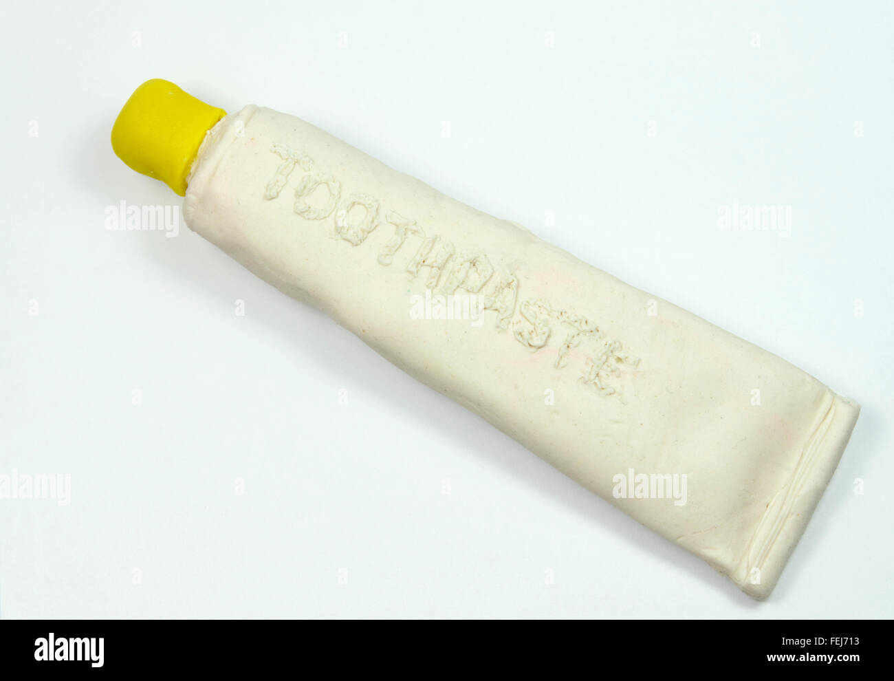 Tubo de dentífrico imitación de play doh. Foto de stock