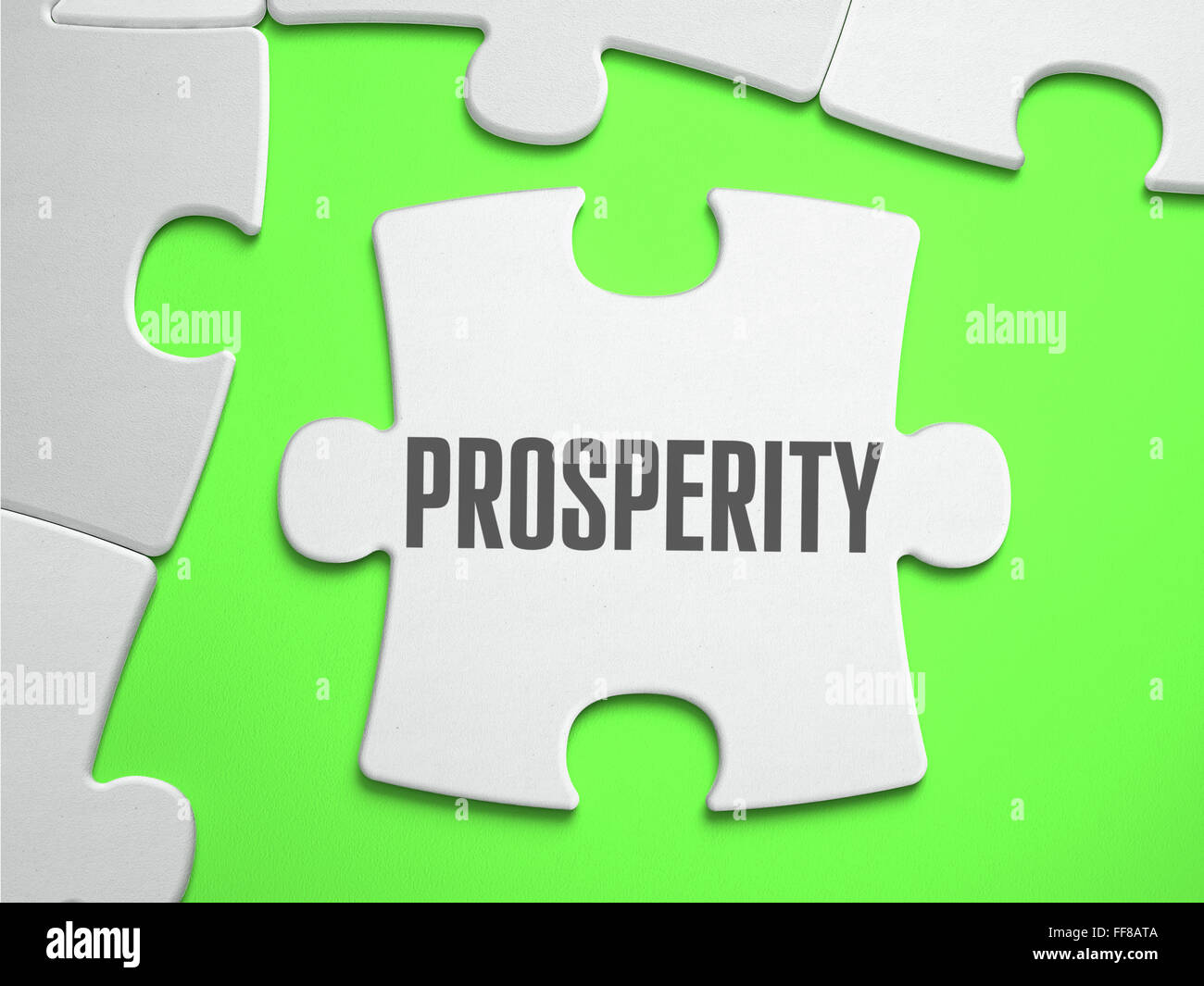 La prosperidad - rompecabezas con piezas faltantes. Foto de stock