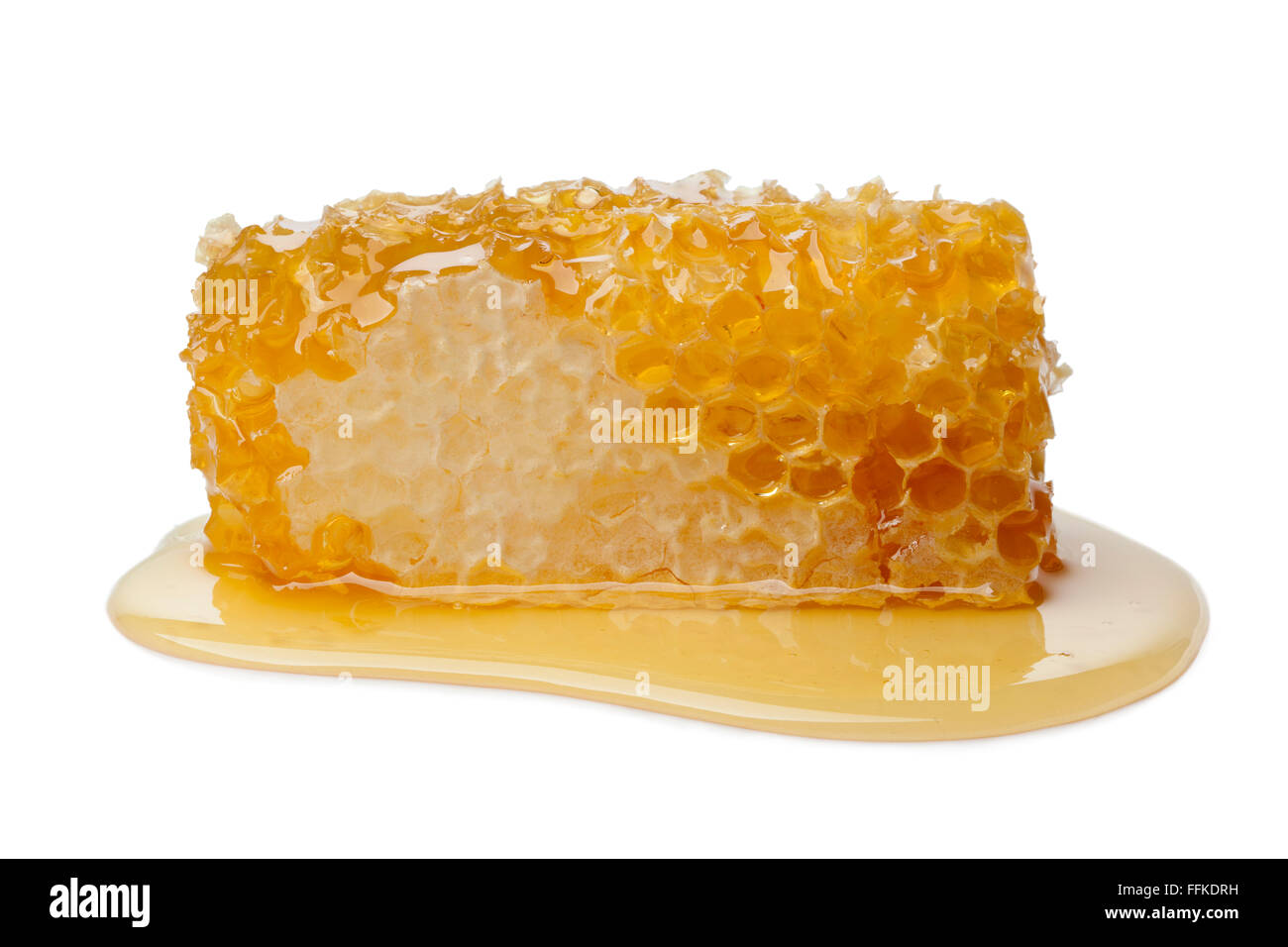 Panal y miel sobre fondo blanco. Foto de stock