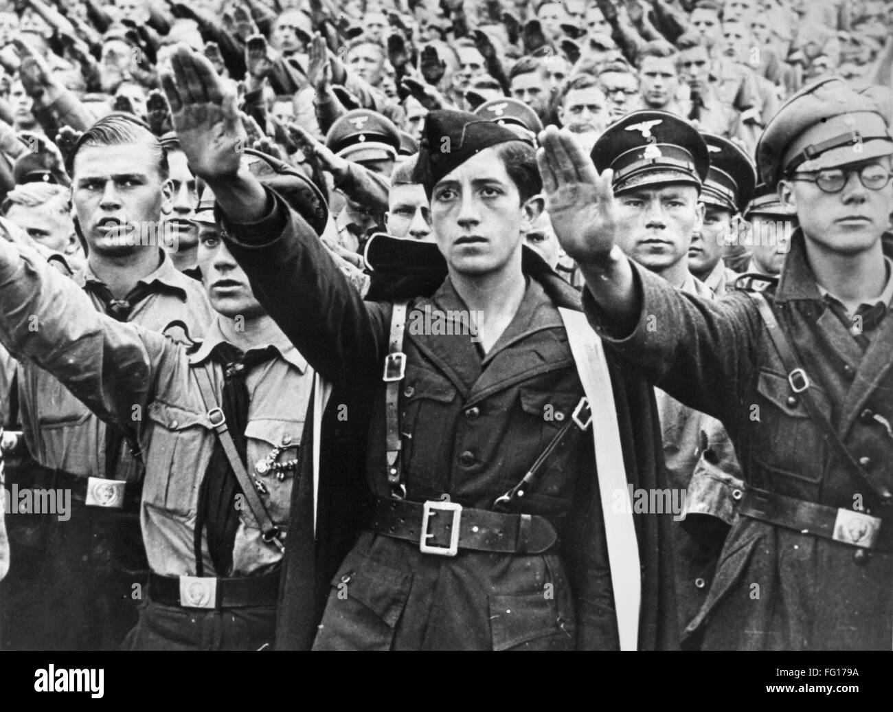 HITLER YOUTH, c1940. /NYoung hombres de las Juventudes Hitlerianas saludando. Fotografía, c1940. Foto de stock