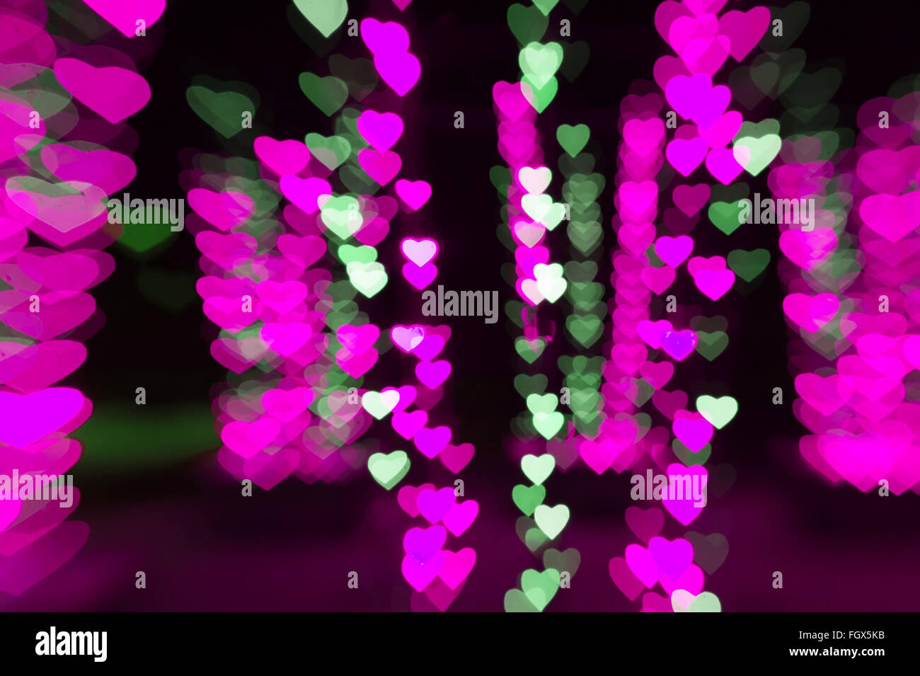 Bokeh de fondo rosa abstracta de corazones para el día de San Valentín Foto de stock