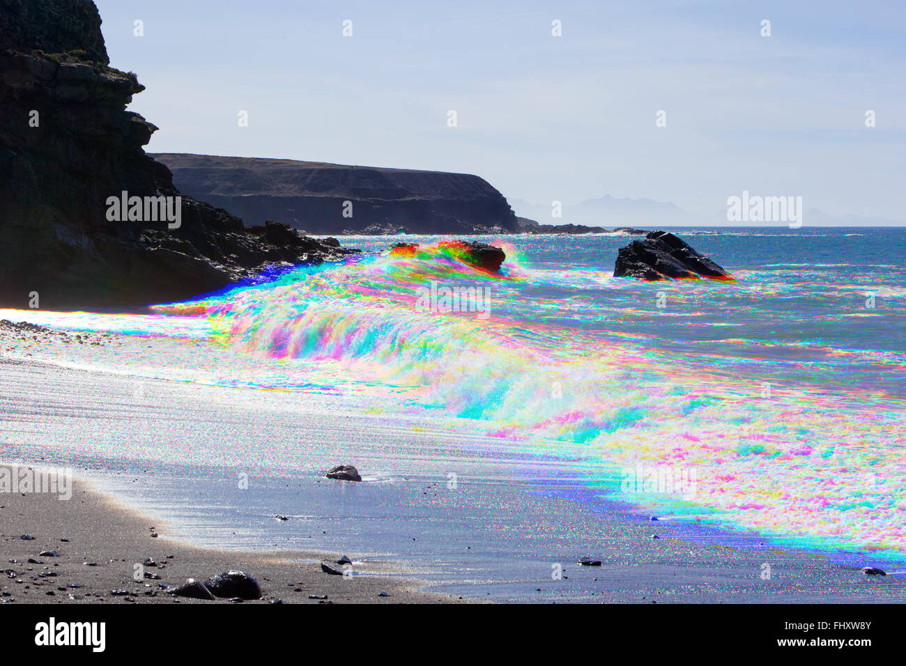 Fotografía de combinación de tres imágenes de colores separados de las olas rompiendo en la playa de Ajuy, Fuerteventura, Islas Canarias, España Foto de stock