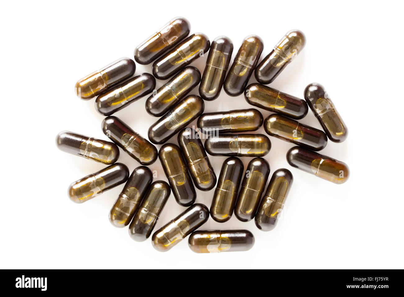 Un montón de hojas de olivo cápsulas suplemento aislado sobre un fondo