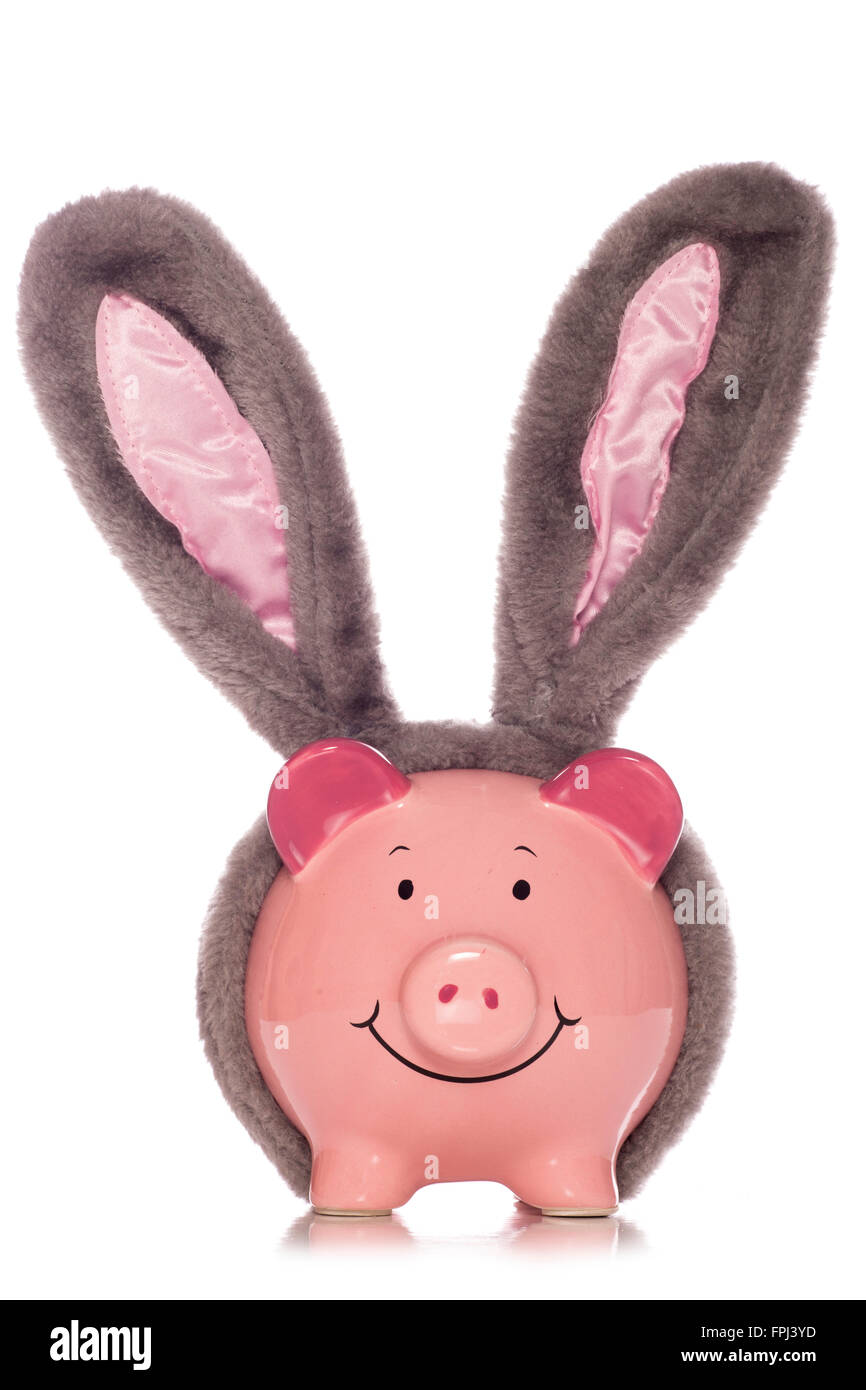 Hucha vistiendo recorte de orejas de conejo de Pascua Foto de stock