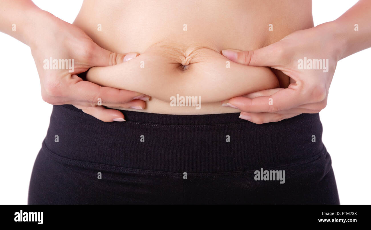 Cerca de mujer pellizcando la grasa del vientre Foto de stock