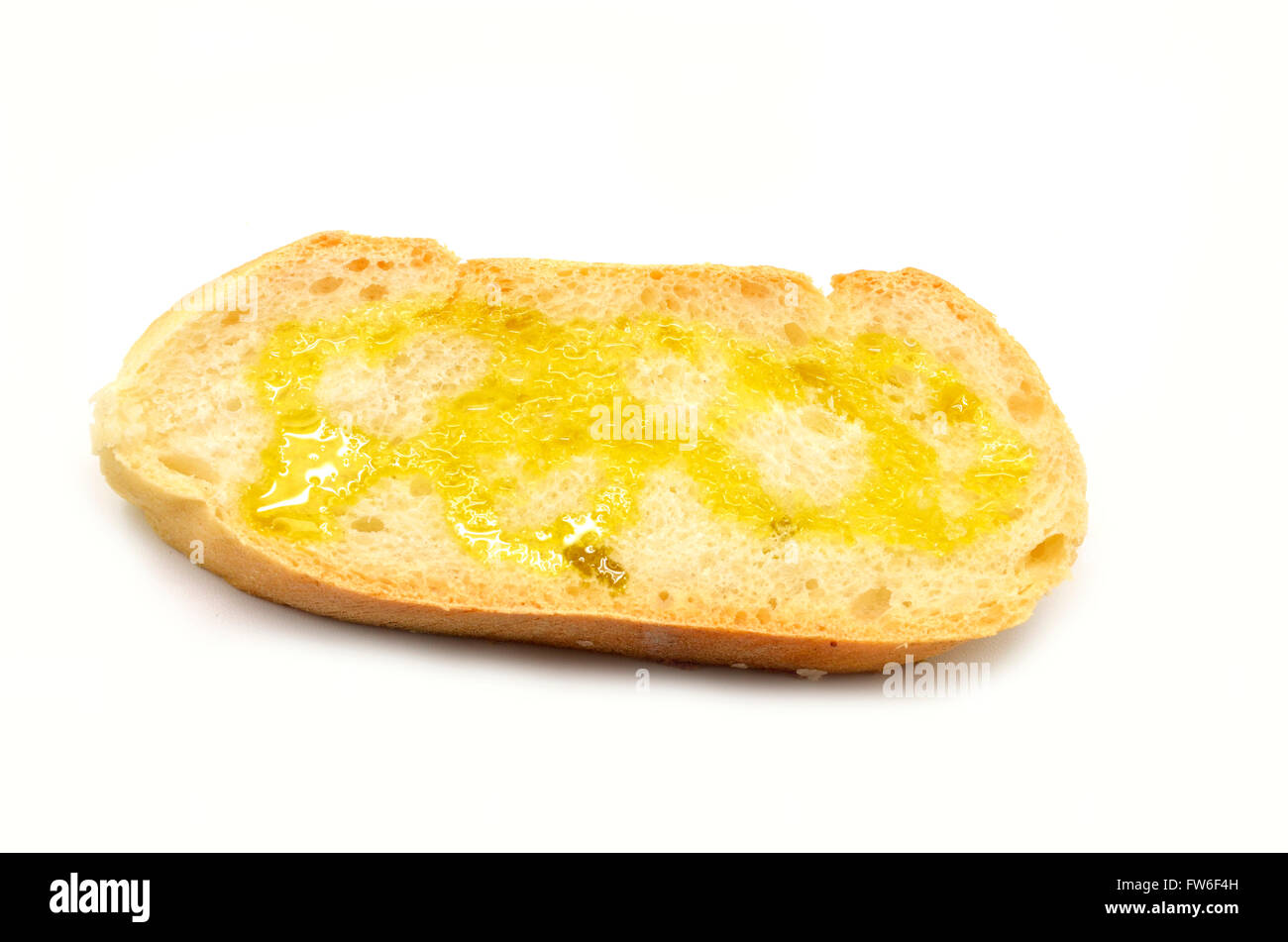 Rebanada de pan con aceite de oliva virgen extra Foto de stock