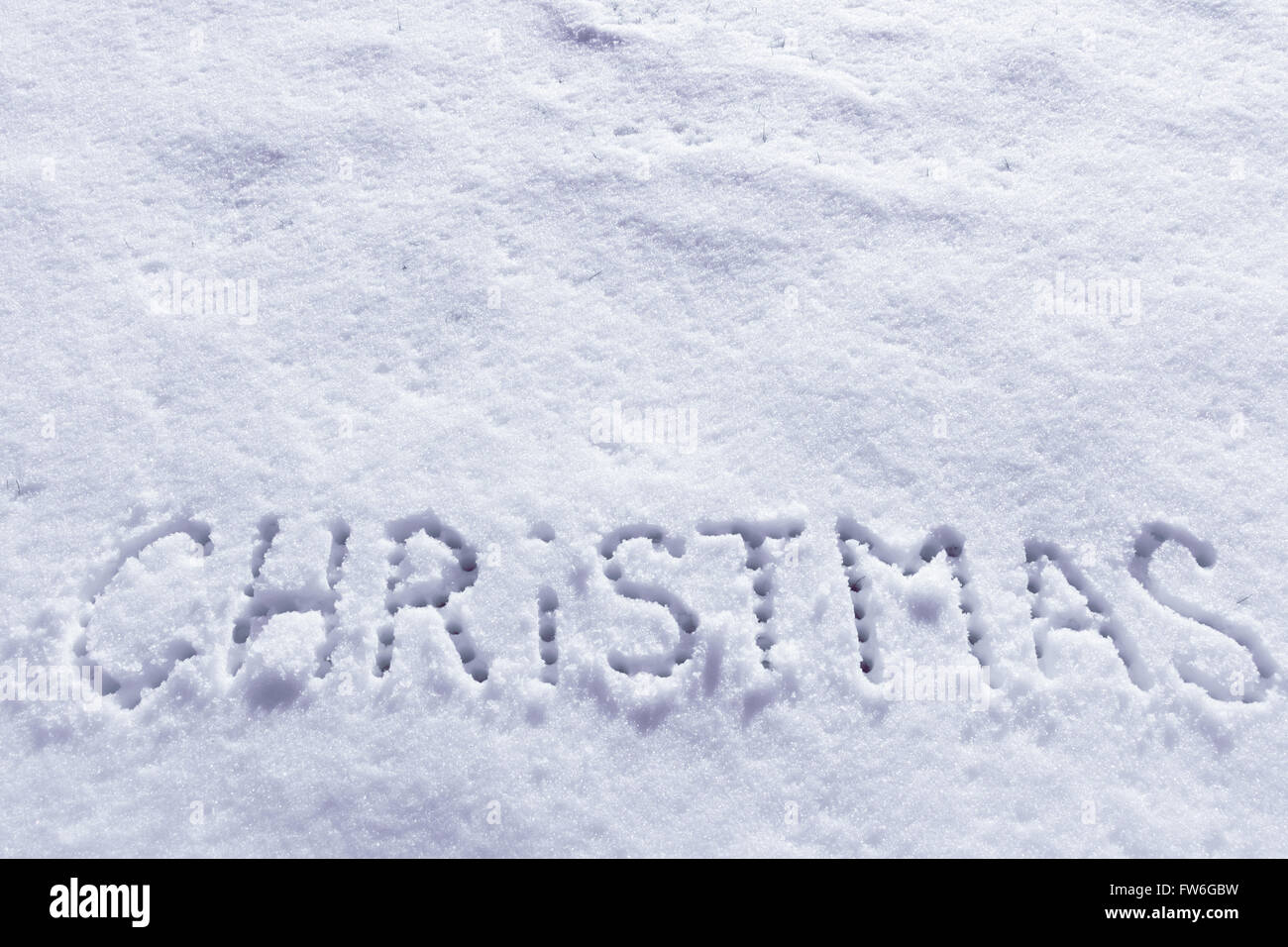 Palabras escritas sobre un campo de nieve de Navidad, Año nuevo concepto. Foto de stock