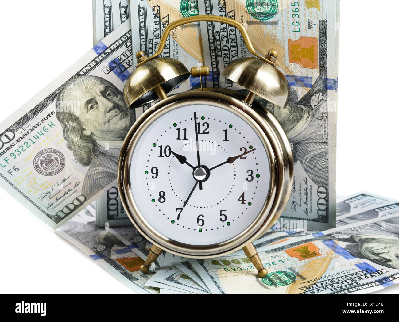 Reloj con alarma y billetes de dólar Foto de stock