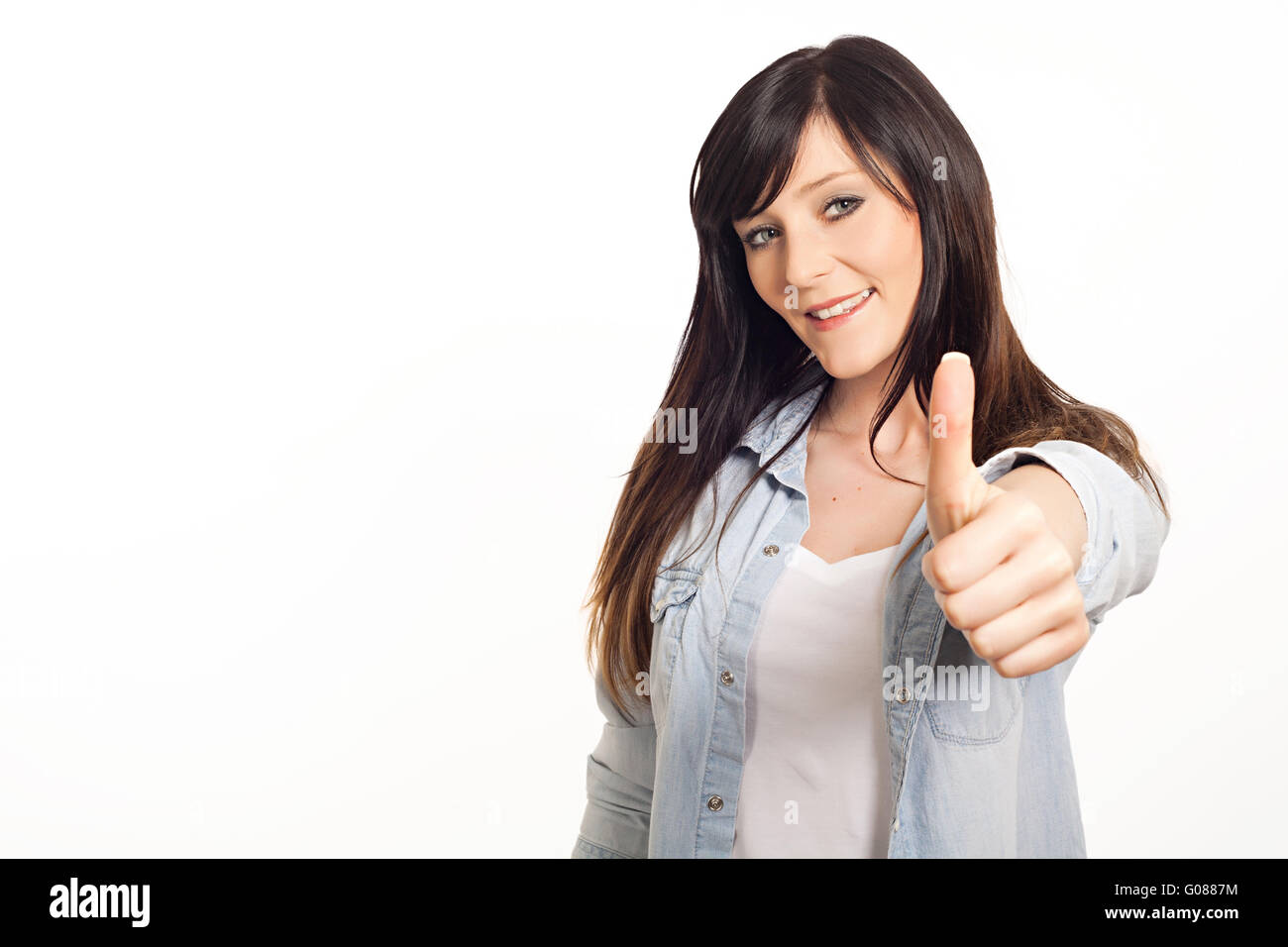 Retrato de una joven y bella mujer Thumbs up Foto de stock