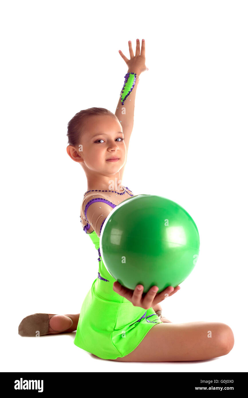 Niña gimnasta con hula hoop y bola verde Fotografía de stock - Alamy