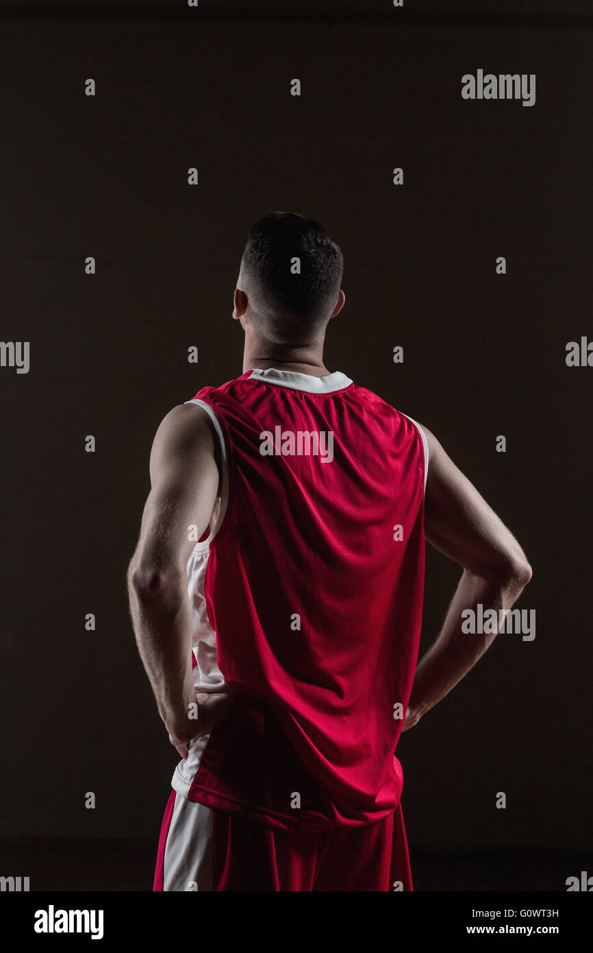 Retrato del jugador de baloncesto, frente la espalda posando Foto de stock