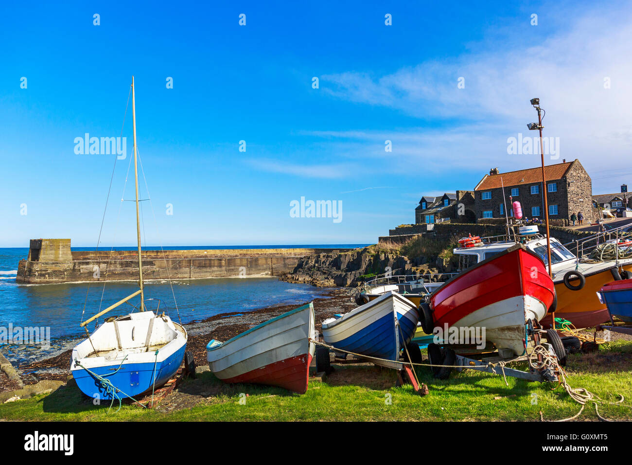 Craster puerto y barcos de pesca, Northumberland, Inglaterra, Reino Unido. Foto de stock