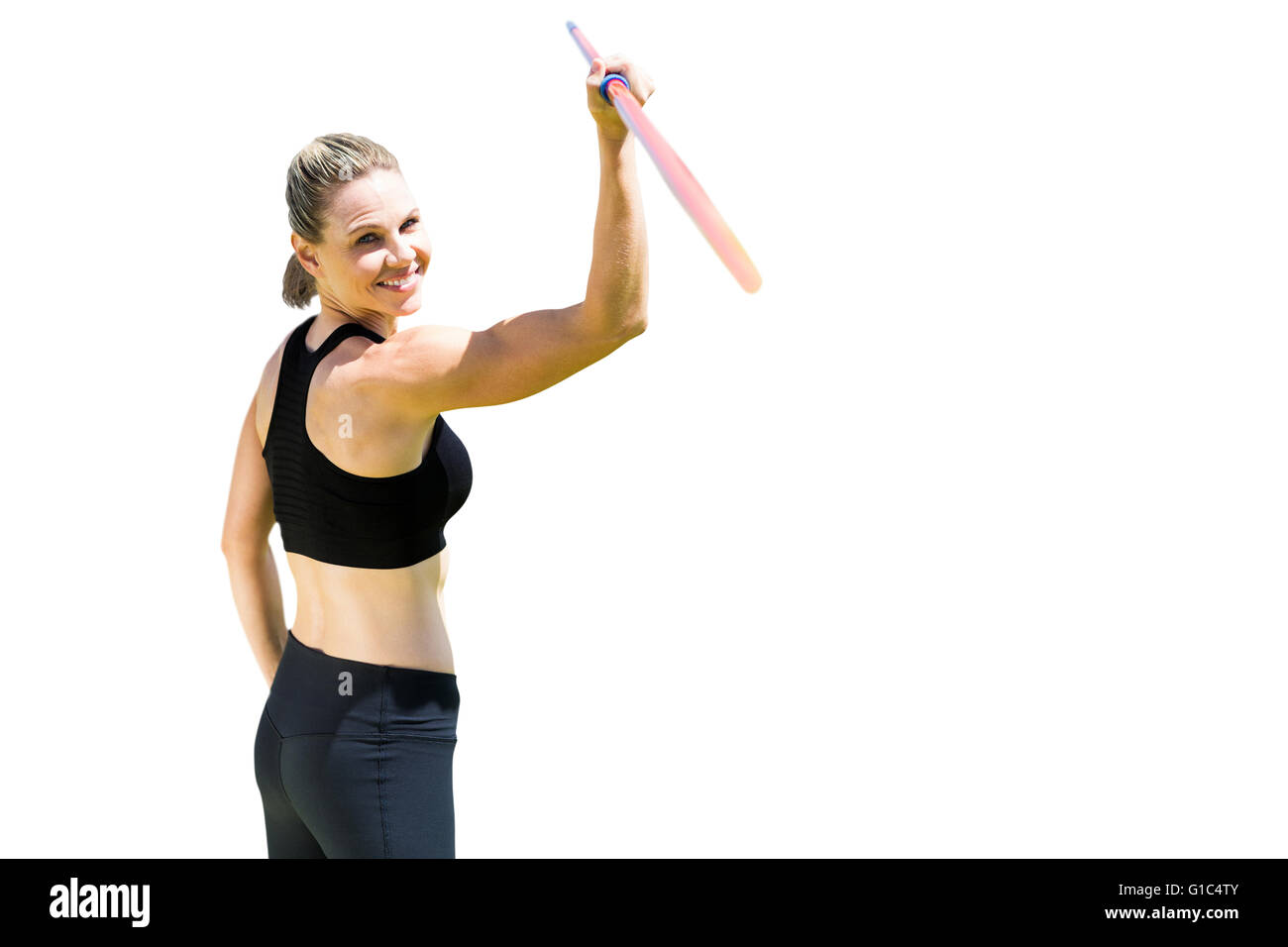 Vista trasera de la mujer sosteniendo un deportivo javelin Foto de stock