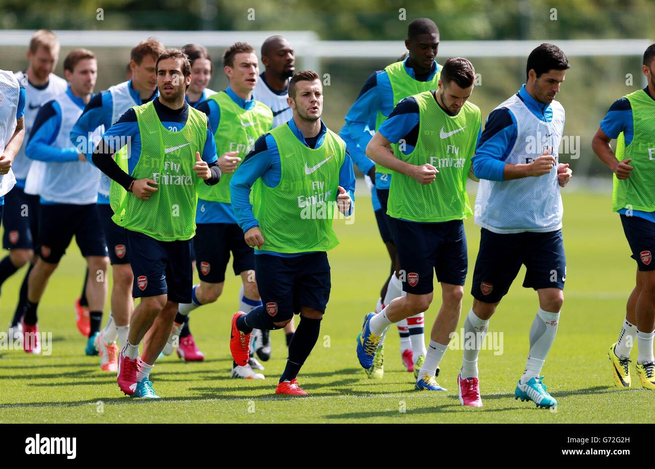 Del Arsenal Jack Wilshere (centro) durante la sesión de formación en London Colney, Hertfordshire. Foto de stock