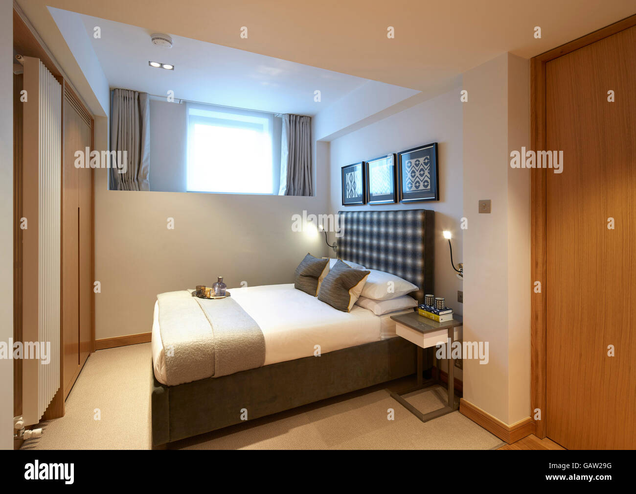 Dormitorio. Apartamento en Crown alcanzar, Londres, Reino Unido. Arquitecto: Burwell Deakins arquitectos, 2016. Foto de stock