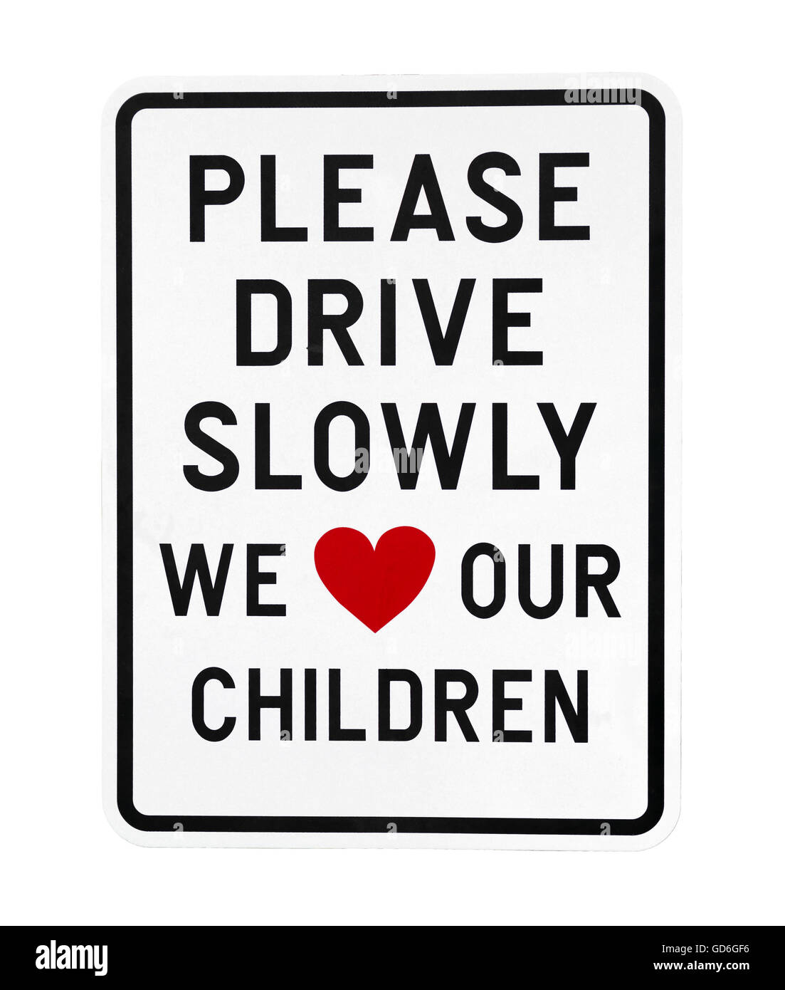 Un cartel con por favor, conduzca despacio que amamos a nuestros hijos con amor, ilustrado en un corazón rojo. Foto de stock