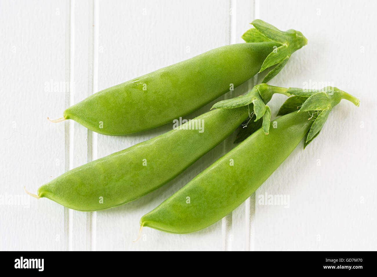 Sugar Snap comestibles arvejas frescas del jardín. Foto de stock