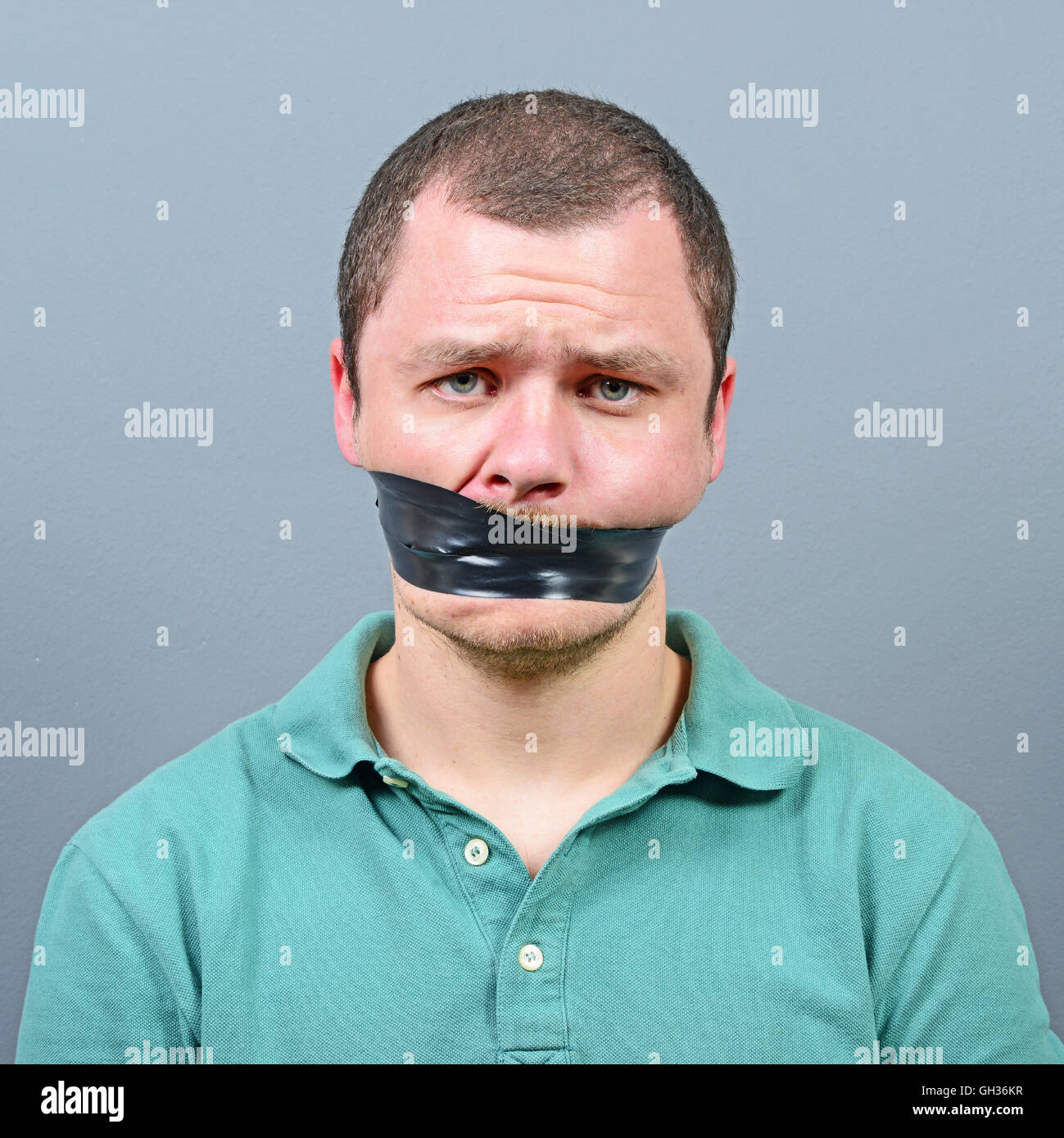 Businessman tape over mouth fotografías e imágenes de alta resolución