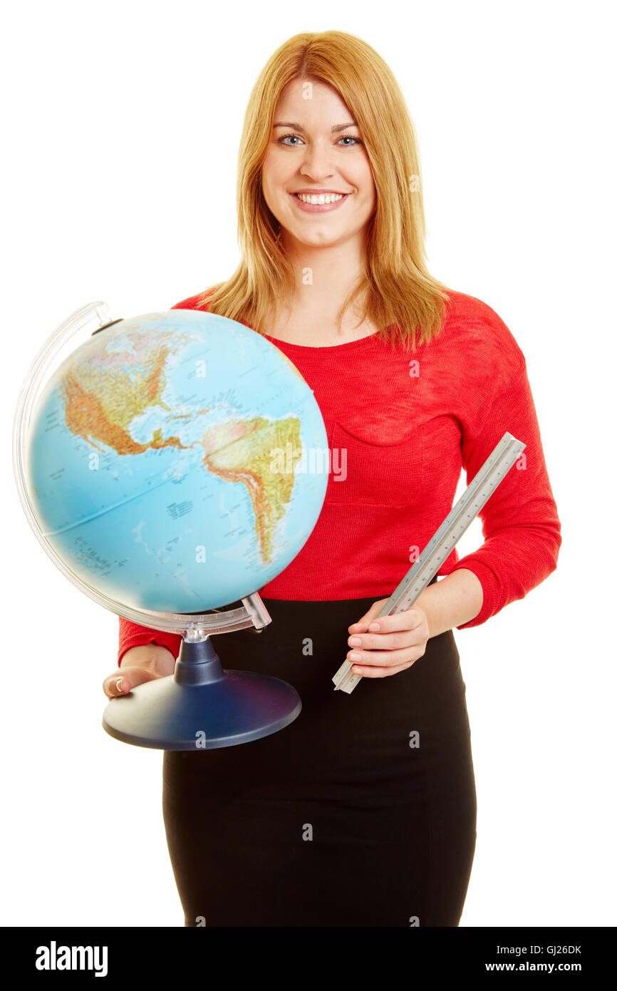 Rubia sonriente maestro con un globo giratorio como profesor de geografía Foto de stock
