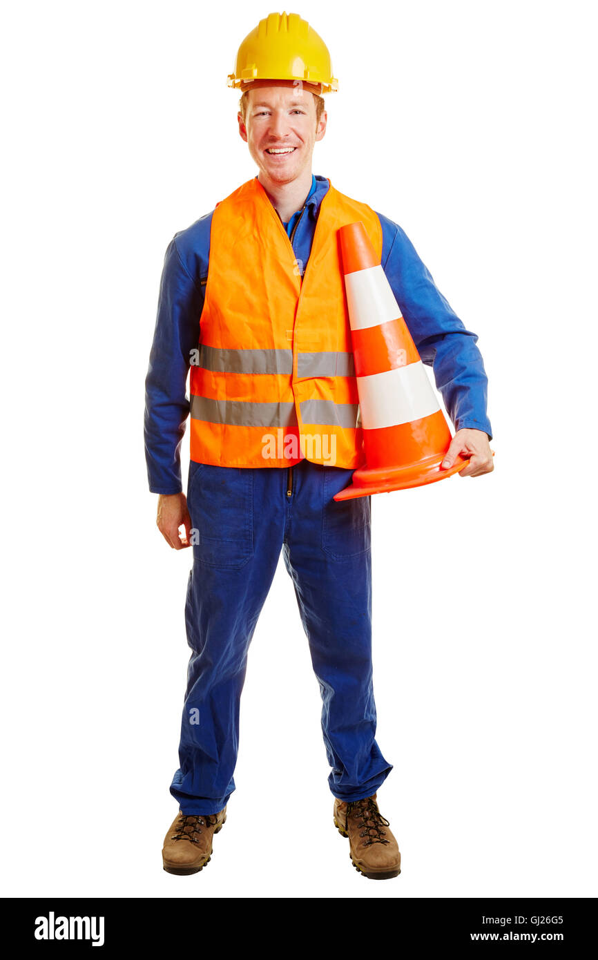 Trabajador de la construcción con un casco y un chaleco de seguridad Foto de stock