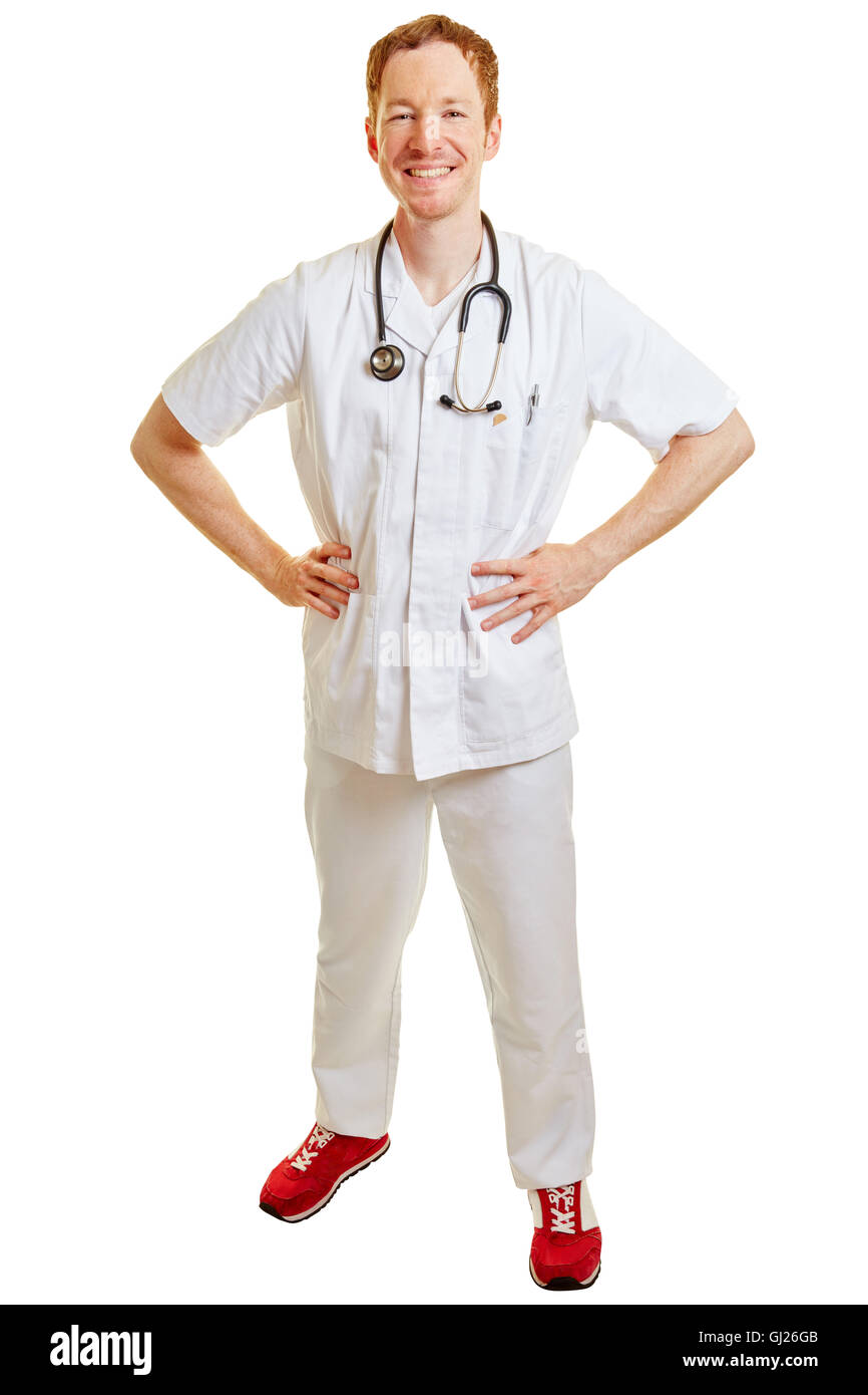 El hombre como un médico o una enfermera sonriente con las manos en la cadera Foto de stock