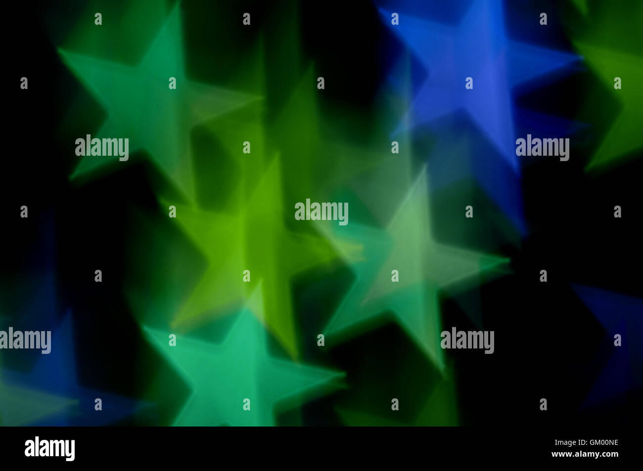 Estrellas azules y verdes bokeh abstract desenfoque de movimiento. Fondo de colores. Foto de stock
